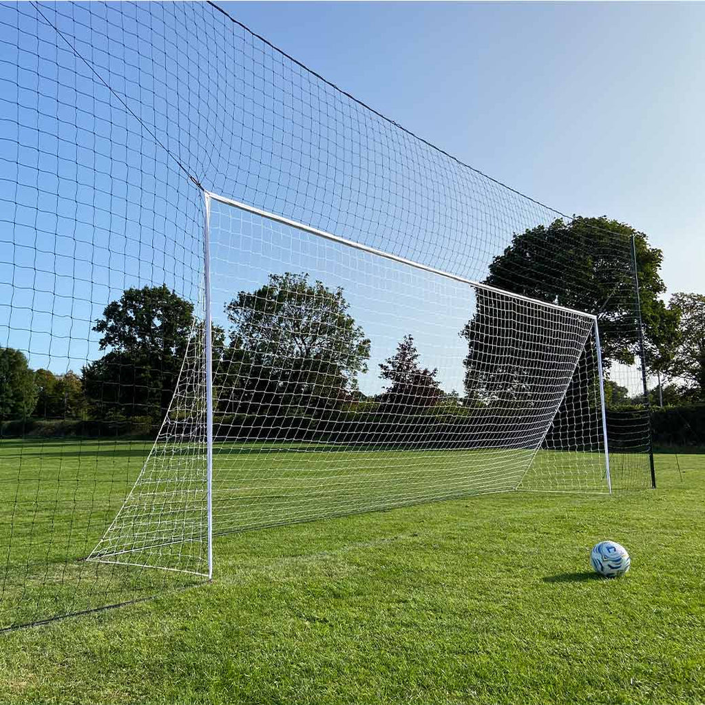 Net of football goal with ball in front