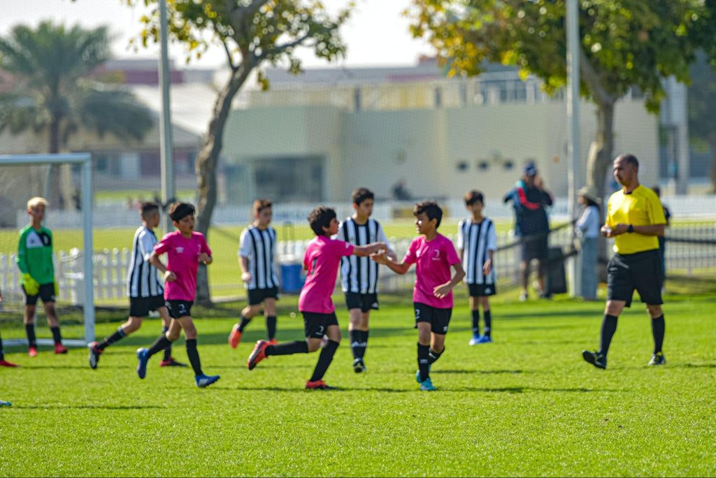 U8 footballers practice trail exercises