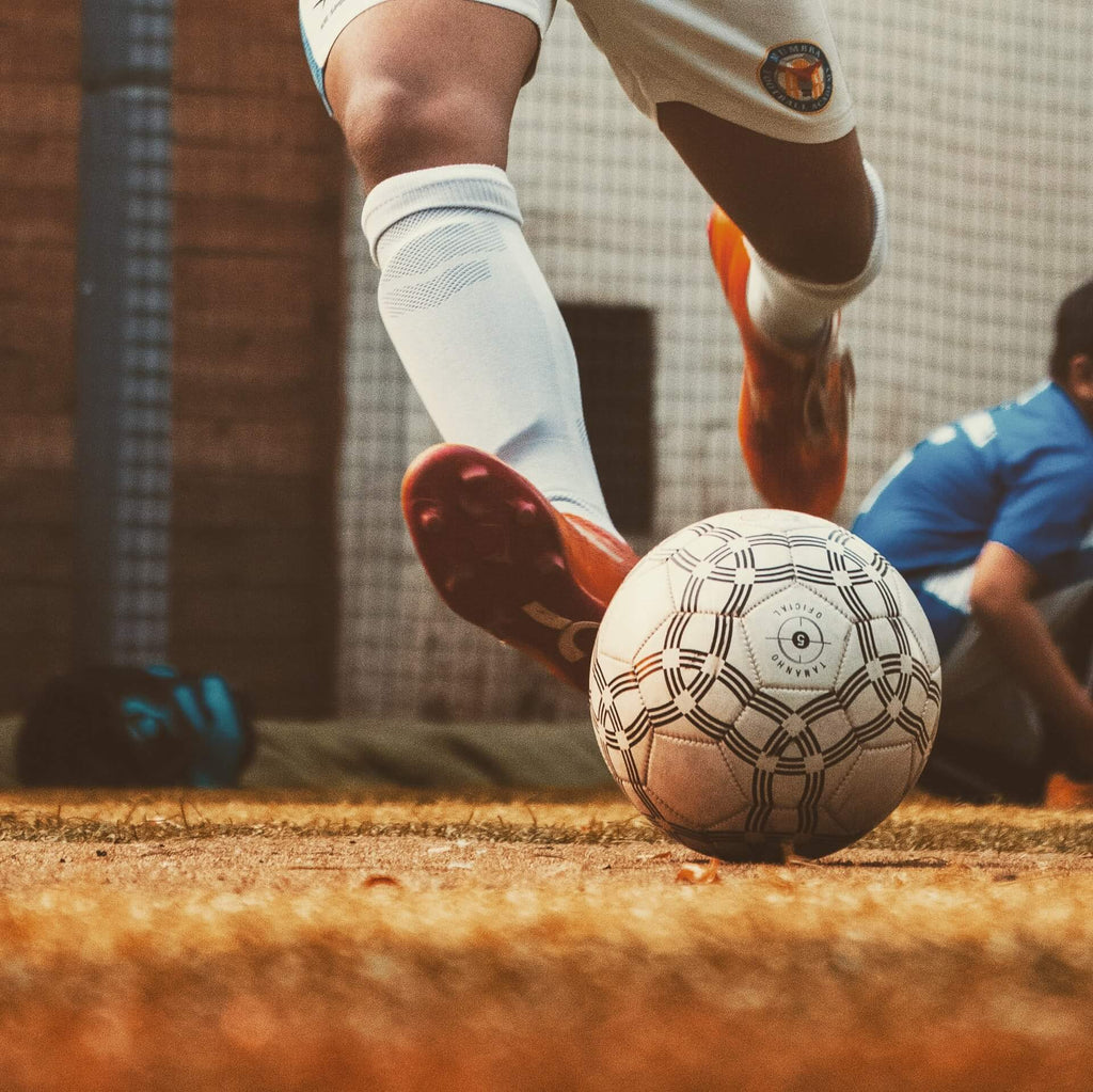 A football player shooting the football ball